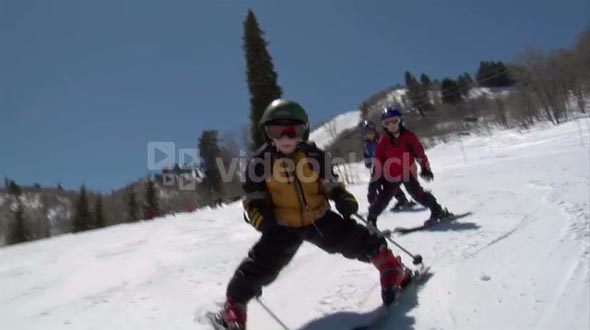 A Little Kid Snowplows Downhill Intently