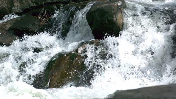 Slow Mo River Rapids Crash Over Rocks