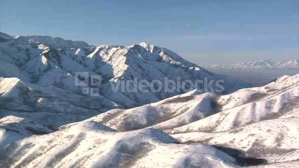 Aerial Shot Of Snowy Mountains With Salt Lake Valley In The Distance