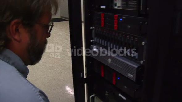 It Technician Walks In Computer Server Room