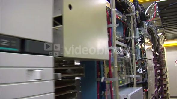 Sweeping Past Racks Of Computer Servers And Equipment