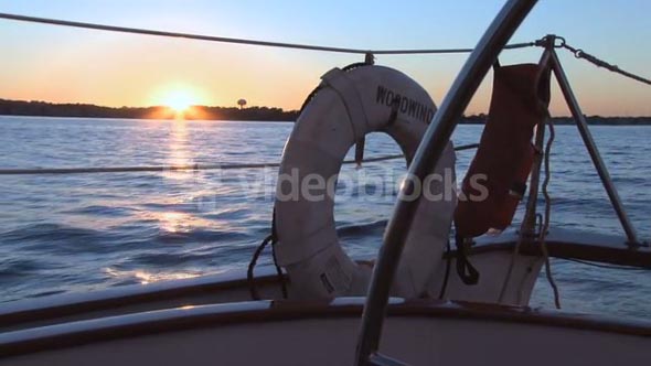 Sailboat Lifesaver and Sun Setting