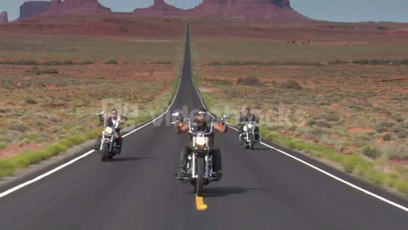 Thee Motorcycles Speed On Desert Highway