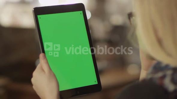 Girl Holding Tablet with Green Screen