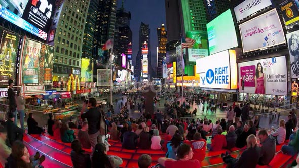 Wide angle view of people enjoying the neon lights of 42nd Street, Times Square, Manhattan, New York City, New York, United States of America, North America, Time-lapse