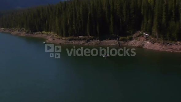 Aerial Shot Of Mountain Lake With Fishermen