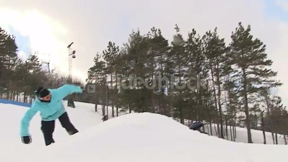 Extreme snowboarder does a backflip barrel roll 