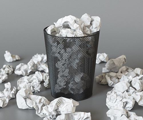 A trash can with papers
