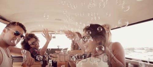 Footage SS - Hipsters blowing bubbles in camper van 6223256