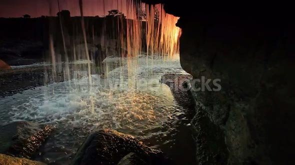 Inside Shot of a Waterfall at Sunset