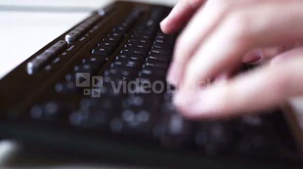 Person Typing on Computer Keyboard